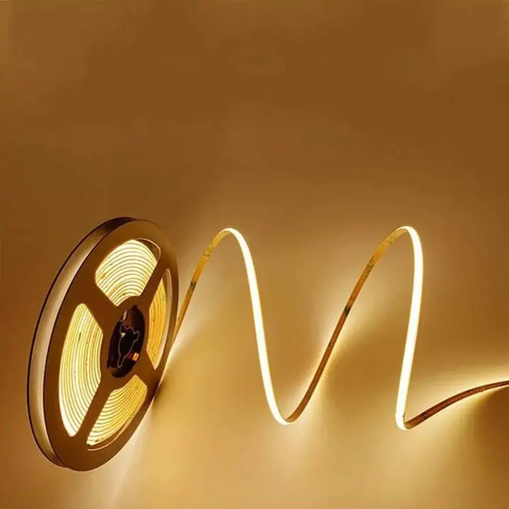 A reel of 3 mm COB flexible LED strip, lit warm white