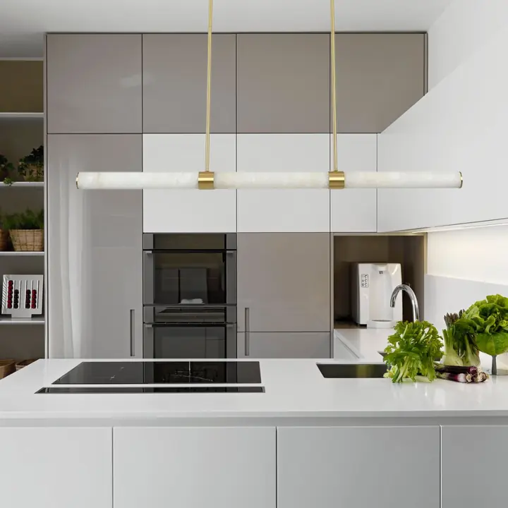 A linear LED pendant in brass and marble by Lighting Creations